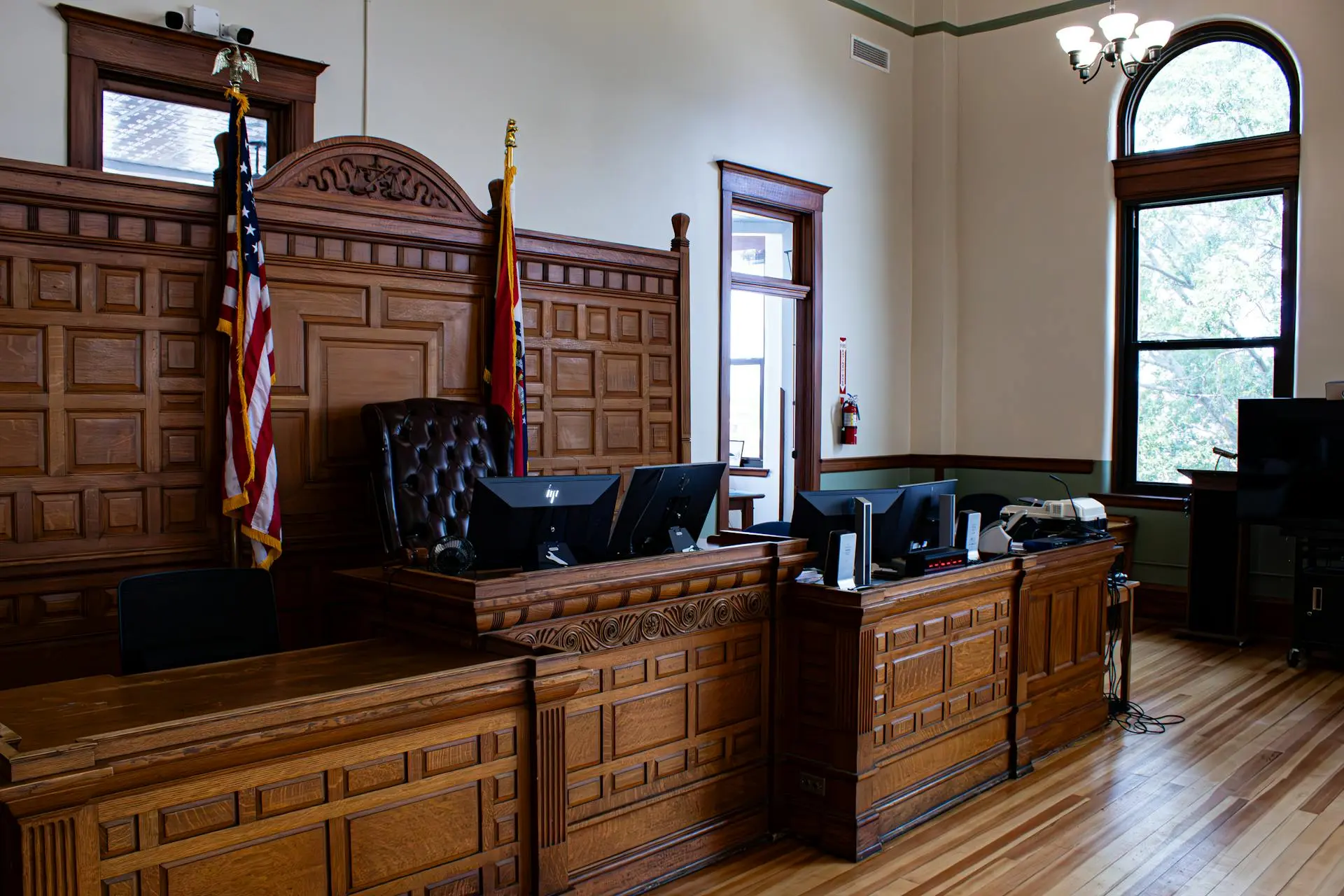 Interior of a New York City courtroom with judge’s bench and seating